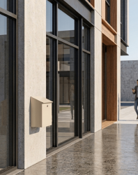 corbeille bourbonnaise Ral 1015 fixée contre un immeuble